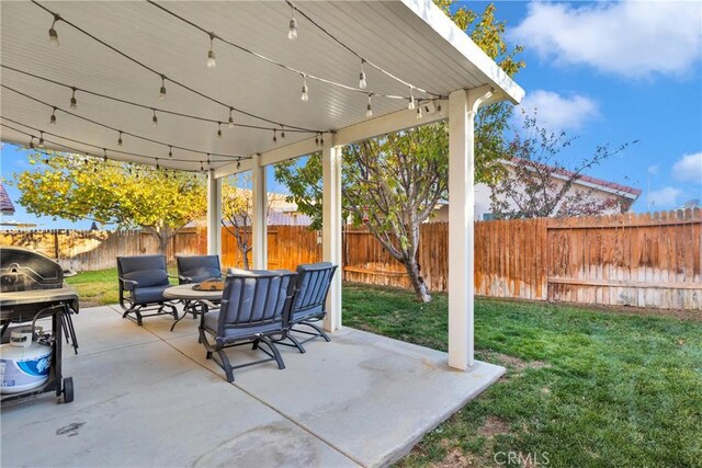 view of patio featuring a grill and a fire pit