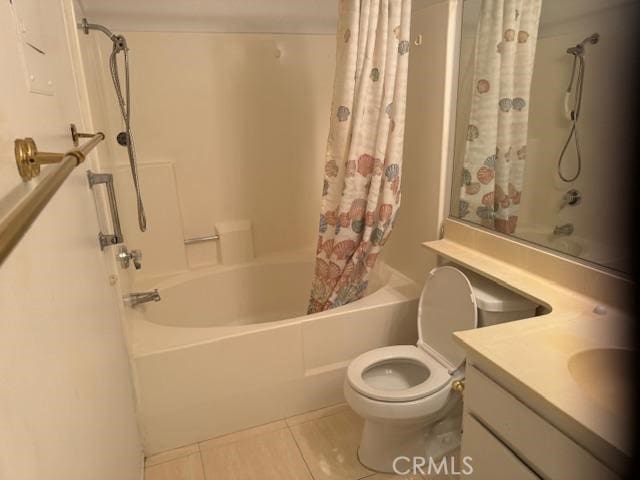 full bathroom with toilet, vanity, tile patterned floors, and shower / bath combo with shower curtain