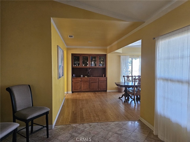 interior space featuring light hardwood / wood-style flooring and ornamental molding