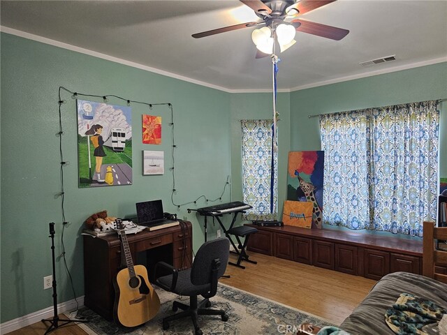 office featuring ceiling fan, crown molding, and light hardwood / wood-style flooring