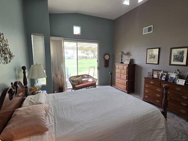 carpeted bedroom featuring access to exterior and lofted ceiling