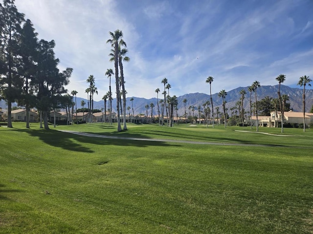 surrounding community featuring a mountain view and a yard