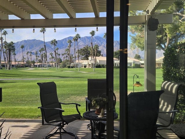 view of patio / terrace with a mountain view and a pergola