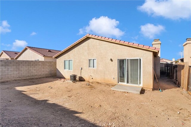 rear view of house with cooling unit