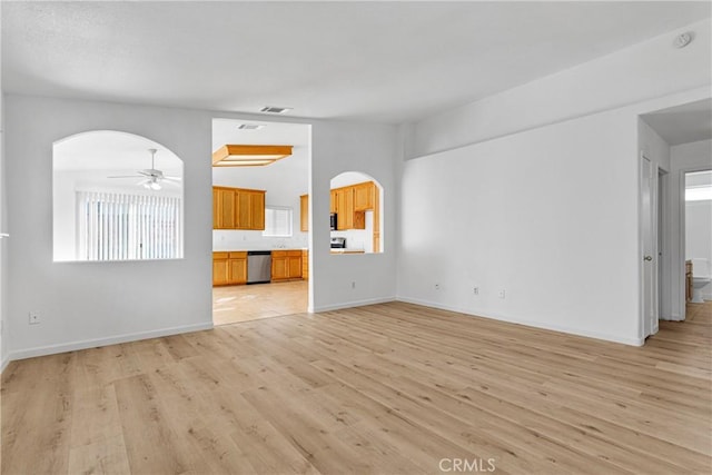 unfurnished living room with ceiling fan and light wood-type flooring