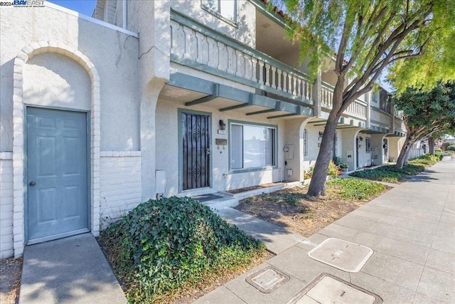 doorway to property with a balcony