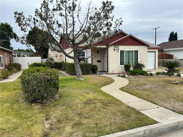 single story home featuring a garage and a front lawn