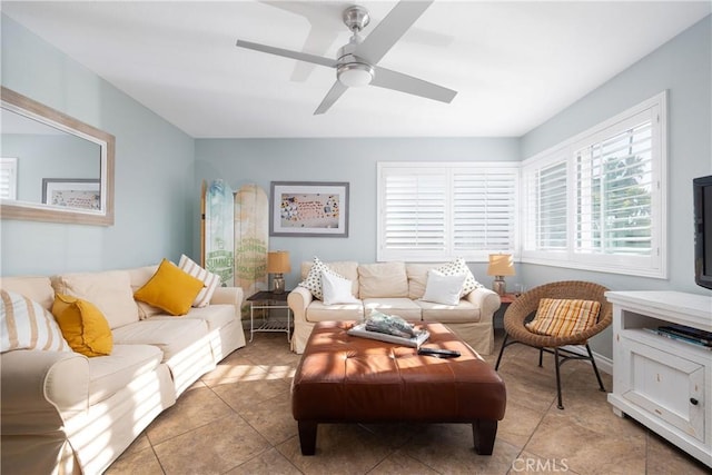 tiled living room with ceiling fan