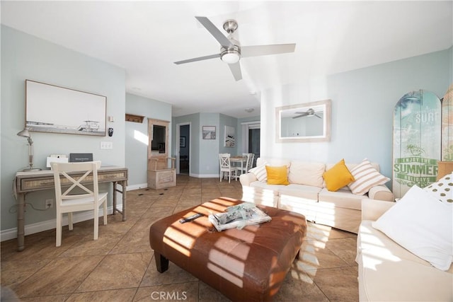 tiled living room featuring ceiling fan