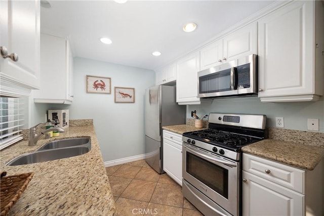 kitchen featuring sink, white cabinets, and stainless steel appliances