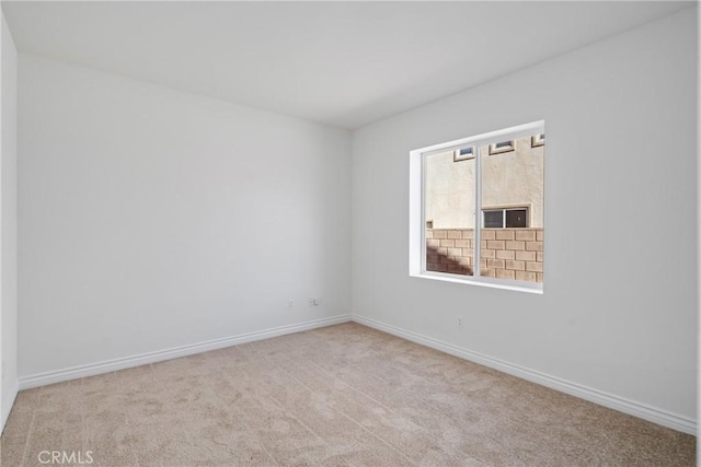 empty room with light colored carpet