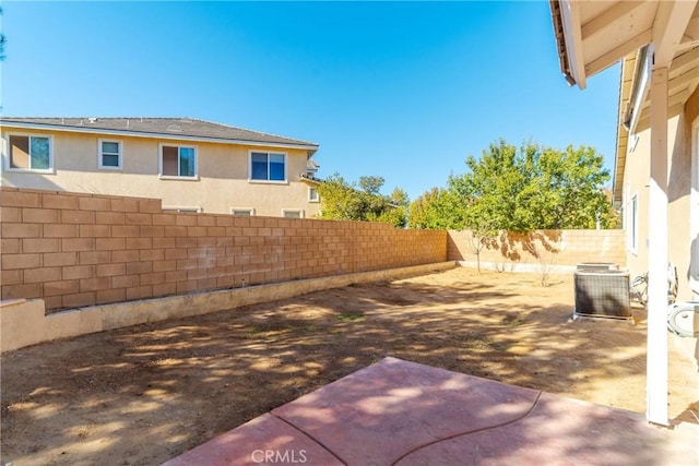 view of yard with a patio area and central AC unit