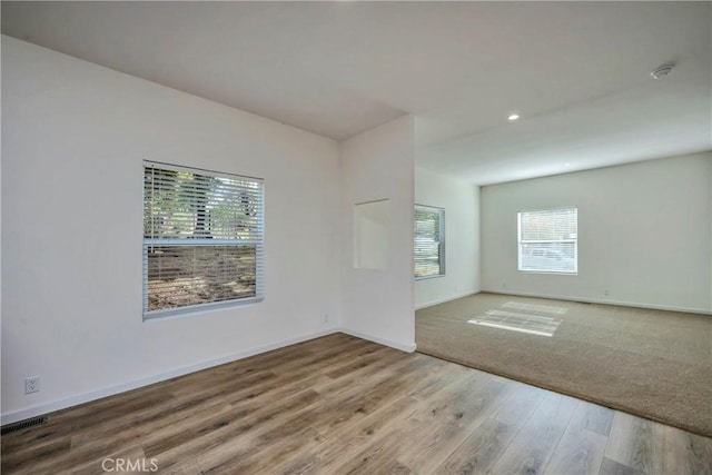 unfurnished room featuring hardwood / wood-style floors