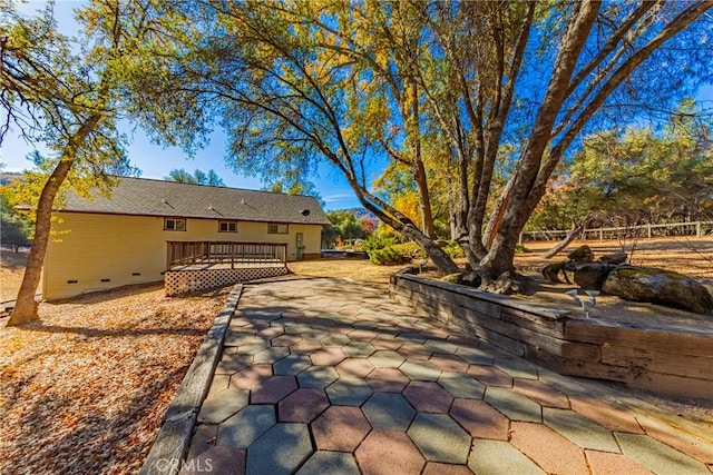 view of patio with a wooden deck