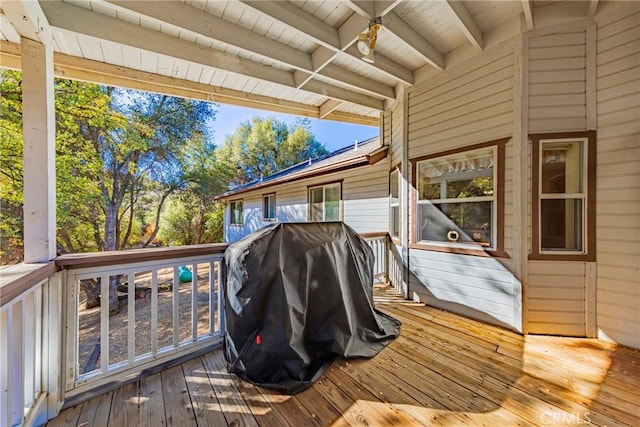 wooden terrace featuring a grill