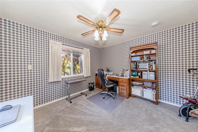 office space with carpet flooring and ceiling fan