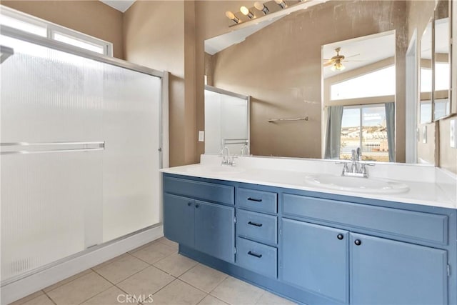 bathroom featuring tile patterned flooring, vanity, plenty of natural light, and walk in shower