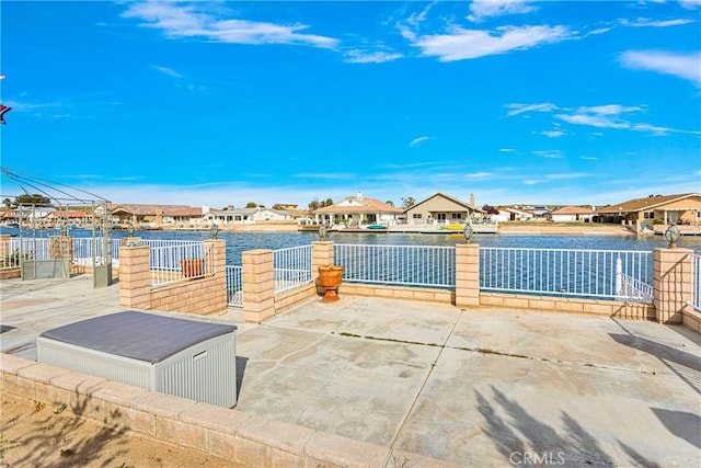 view of patio featuring a water view