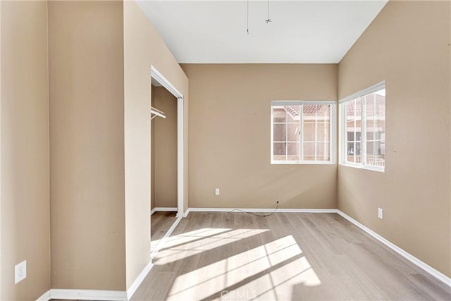 unfurnished bedroom with light wood-type flooring