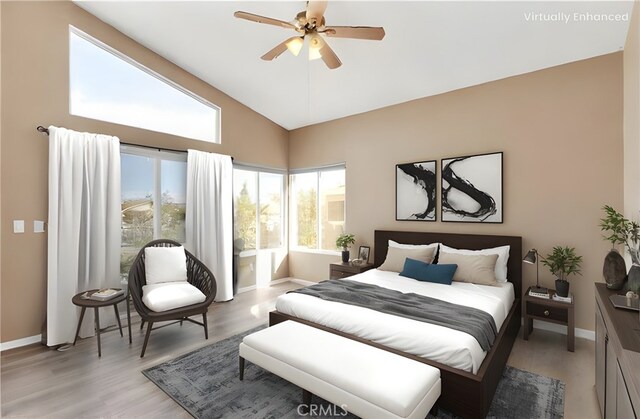 bedroom featuring ceiling fan, high vaulted ceiling, and light hardwood / wood-style floors