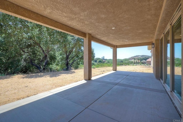 view of patio / terrace with a mountain view