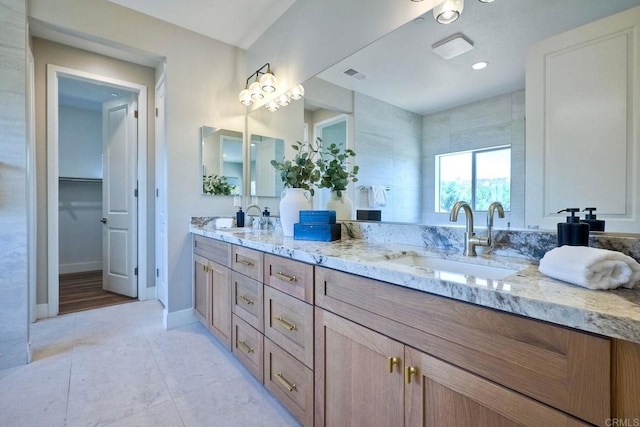 bathroom with tile patterned flooring and vanity