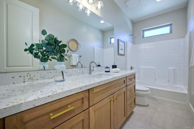 full bathroom with tile patterned flooring, vanity, toilet, and  shower combination