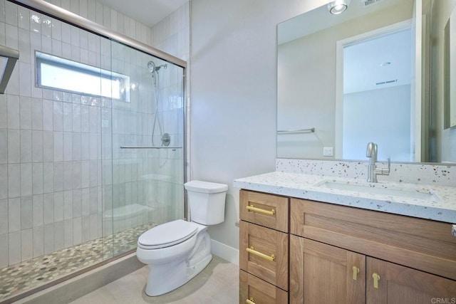 bathroom with vanity, toilet, and walk in shower