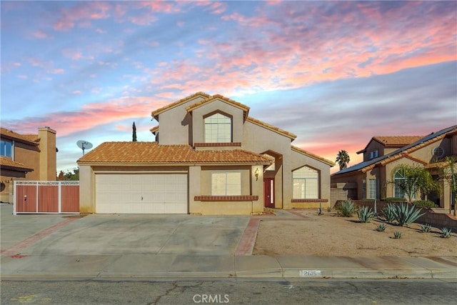 mediterranean / spanish-style house featuring a garage