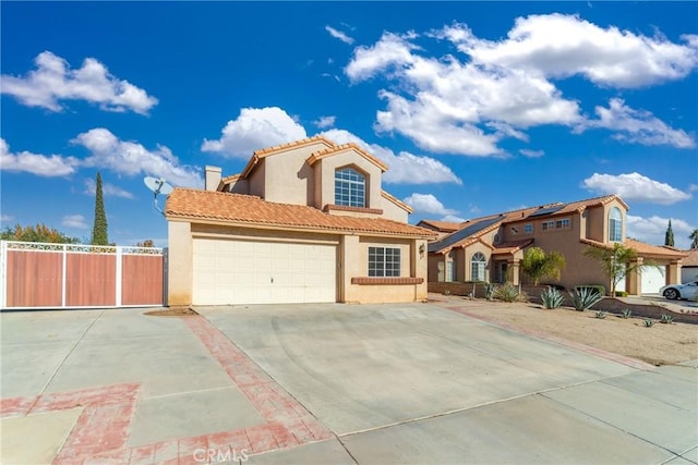 mediterranean / spanish-style house with a garage