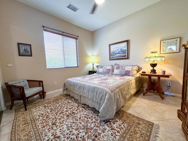 bedroom featuring ceiling fan and light tile patterned floors