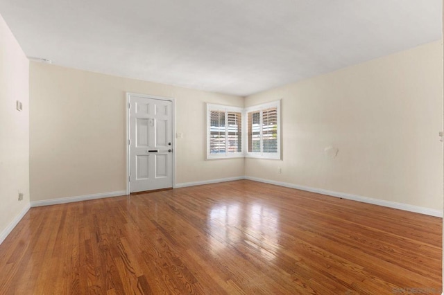 spare room featuring hardwood / wood-style floors