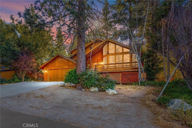 view of front of house featuring a wooden deck and a garage