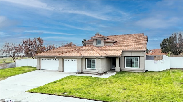 view of front of home with a front lawn and a garage