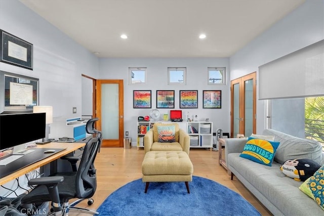 office area featuring french doors and light hardwood / wood-style floors