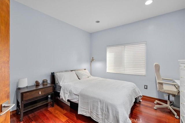 bedroom featuring dark hardwood / wood-style floors