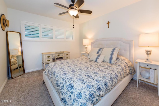 bedroom featuring ceiling fan and light colored carpet