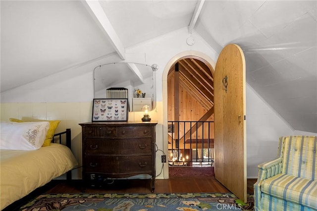 bedroom featuring lofted ceiling with beams and dark hardwood / wood-style floors