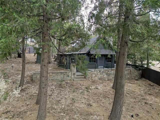 view of property hidden behind natural elements