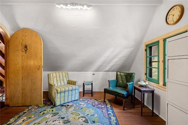 sitting room with lofted ceiling and hardwood / wood-style flooring