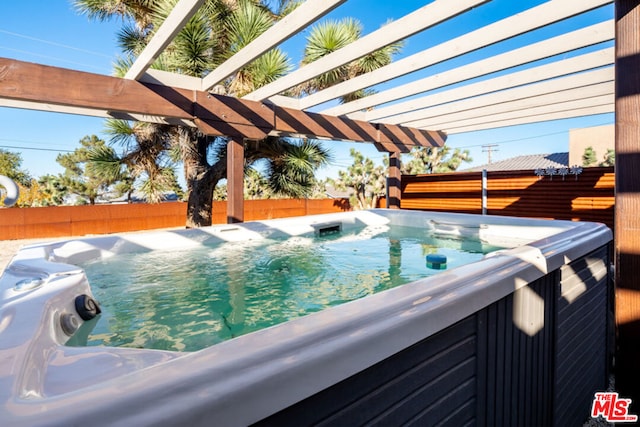 exterior space with a hot tub