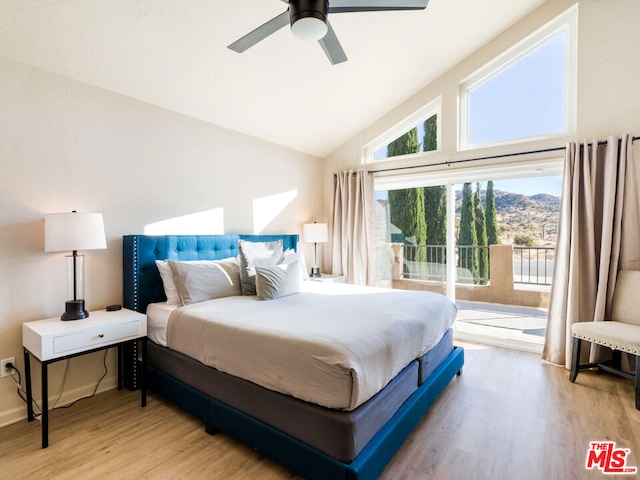 bedroom featuring ceiling fan, high vaulted ceiling, and light wood-type flooring