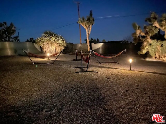 view of yard at twilight