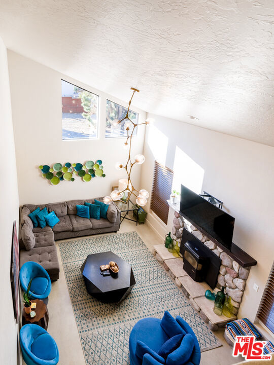 living room with a textured ceiling