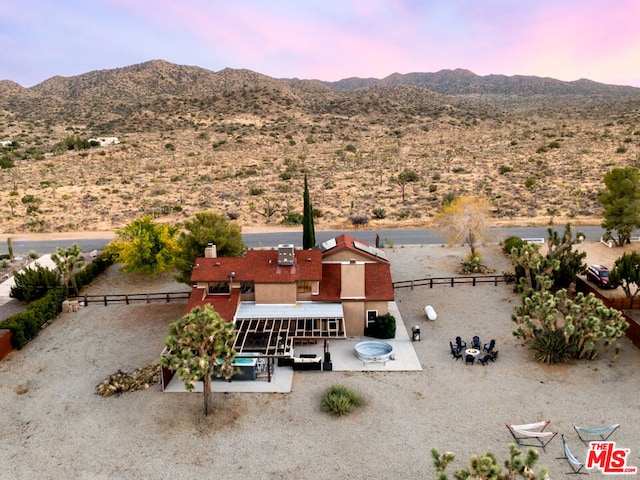 aerial view at dusk with a mountain view