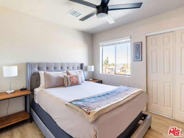 bedroom featuring ceiling fan and light wood-type flooring