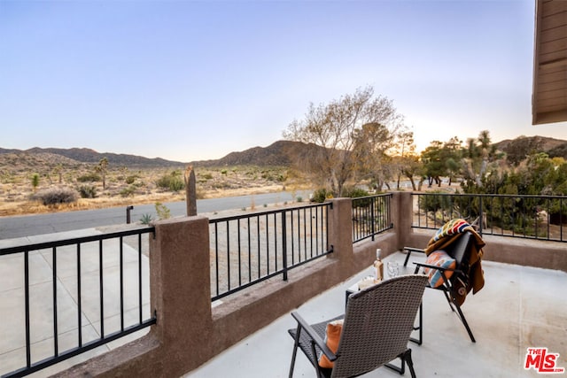 balcony featuring a mountain view