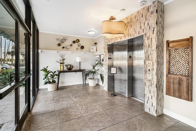 interior space with elevator and crown molding