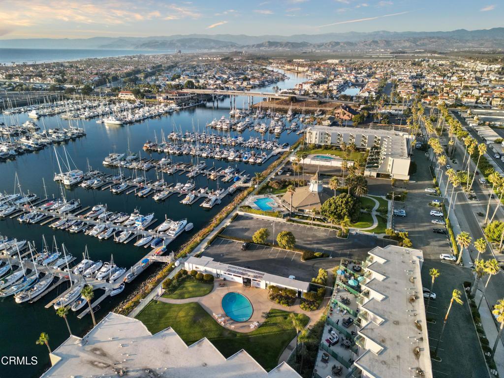 aerial view featuring a water and mountain view