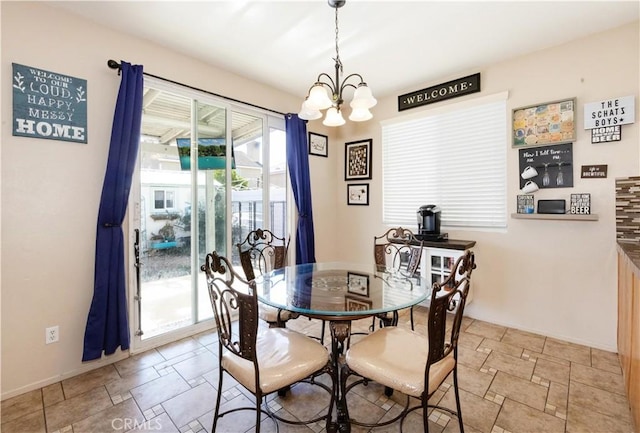 dining room featuring a notable chandelier